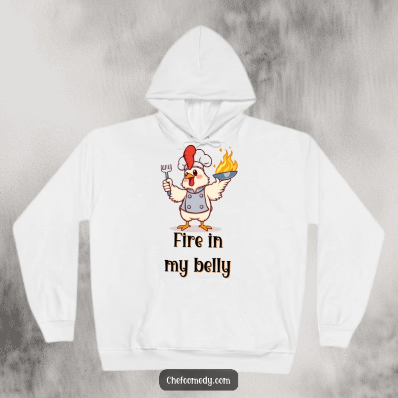 Funny hoodie showcasing a flamboyant chicken chef in mid-action, flamboyantly tossing a flaming frying pan, ideal for cozy cooks.