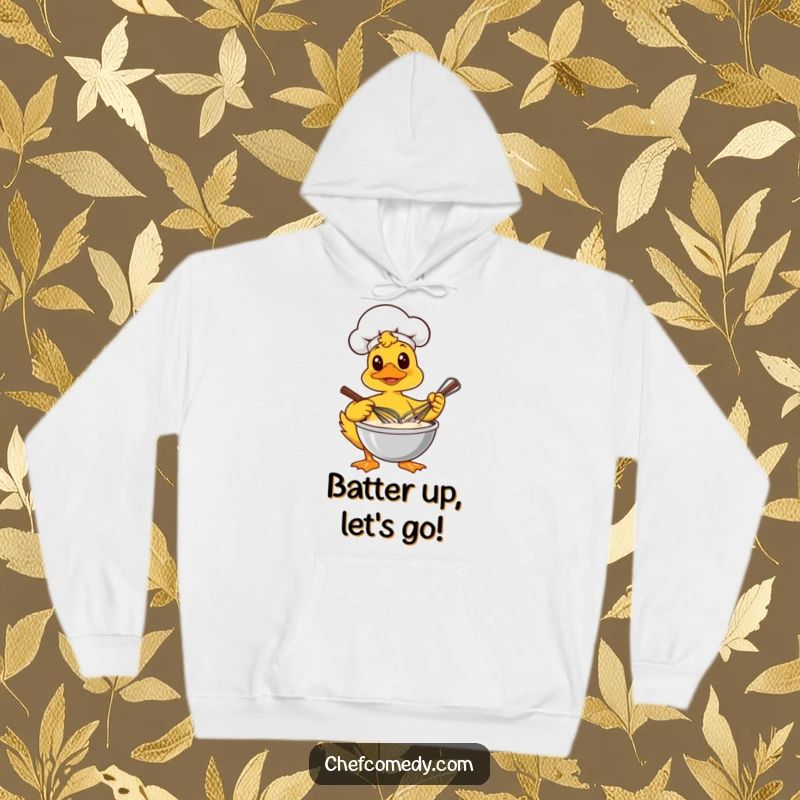 Funny hoodie depicting a determined duck chef energetically whisking a bowl of thick, creamy batter, ideal for cozy bakers.
