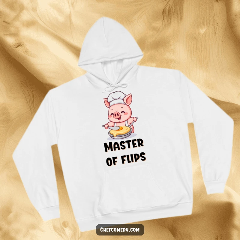 Funny Kawaii pig chef hoodie, showing a happy pig chef concentrating intensely while flipping a pancake with great glee.