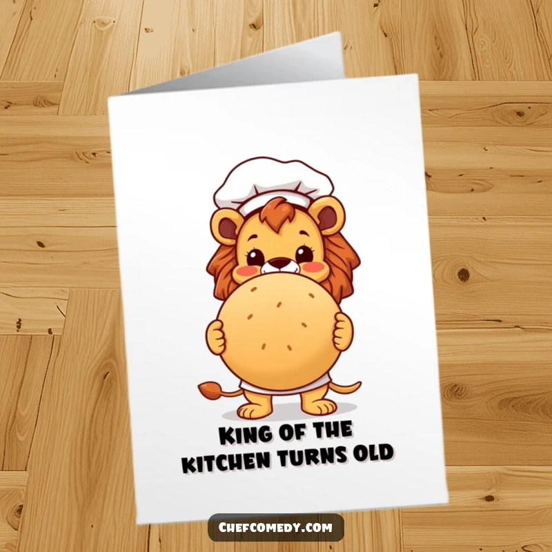 Funny Free Printable Birthday Card: Smiling lion chef proudly presents a huge, round bread loaf with a warm birthday wish.