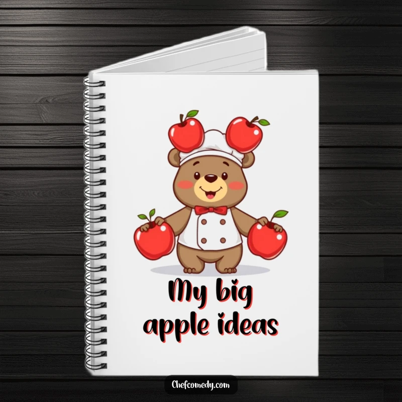 Funny bear chef with impressive skill juggling three shiny red apples, on a notebook cover for capturing creative and humorous ideas.
