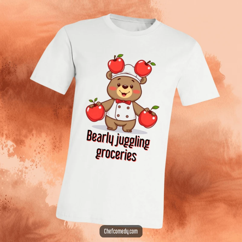 Funny proud bear chef gleefully juggling three bright red apples, showcasing culinary skill and playful humor on a t-shirt.